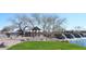 Scenic entrance to Rancho Mirage featuring water feature, green space, and desert landscaping at 38133 W Vera Cruz Dr, Maricopa, AZ 85138