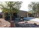 House exterior with driveway and mature trees at 38133 W Vera Cruz Dr, Maricopa, AZ 85138