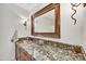 Modern bathroom with a copper sink and granite vanity at 3817 N Jokake Dr, Scottsdale, AZ 85251