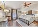 Cozy bedroom with hardwood floors and a ceiling fan at 3817 N Jokake Dr, Scottsdale, AZ 85251