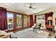 Serene bedroom with hardwood floors, french doors to backyard, and sitting area at 3817 N Jokake Dr, Scottsdale, AZ 85251
