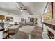 Open living room with hardwood floors, fireplace, and comfortable seating area at 3817 N Jokake Dr, Scottsdale, AZ 85251
