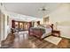Main bedroom with hardwood floors, access to the backyard, and a sitting area at 3817 N Jokake Dr, Scottsdale, AZ 85251