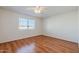 Bedroom with laminate wood flooring and ceiling fan at 4205 E Calypso Ave, Mesa, AZ 85206