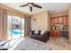 Gathering room with sliding glass doors, pool view, and a wet bar at 4206 E Ellis Cir, Mesa, AZ 85205