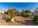 Landscaped backyard with garden and patio area at 437 E Germann Rd # 24, San Tan Valley, AZ 85140