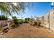 Spacious backyard with garden and gravel area at 437 E Germann Rd # 24, San Tan Valley, AZ 85140