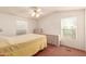 Comfortable bedroom with a ceiling fan and ample closet space at 437 E Germann Rd # 24, San Tan Valley, AZ 85140