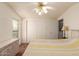 Spacious bedroom with a ceiling fan and built-in dresser at 437 E Germann Rd # 24, San Tan Valley, AZ 85140