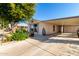 Mobile home with carport and lush landscaping at 437 E Germann Rd # 24, San Tan Valley, AZ 85140