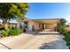 Mobile home with carport and well-maintained landscaping at 437 E Germann Rd # 24, San Tan Valley, AZ 85140