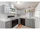 Galley kitchen with gray cabinets and modern appliances at 437 E Germann Rd # 24, San Tan Valley, AZ 85140