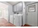 Convenient laundry area with washer, dryer, and cabinets at 437 E Germann Rd # 24, San Tan Valley, AZ 85140