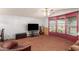Living room with bay window, tv, and seating at 437 E Germann Rd # 24, San Tan Valley, AZ 85140