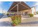 Charming covered patio area with seating, perfect for enjoying the outdoors and socializing with neighbors at 437 E Germann Rd # 24, San Tan Valley, AZ 85140