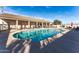 Enjoy the community pool with comfortable lounge chairs and shade, ideal for relaxation at 437 E Germann Rd # 24, San Tan Valley, AZ 85140