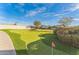 Lush community putting green, perfect for honing your skills or enjoying a friendly competition at 437 E Germann Rd # 24, San Tan Valley, AZ 85140