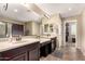 Bright bathroom featuring dual vanities and a large mirror at 472 W Dragon Tree Ave, Queen Creek, AZ 85140