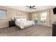 Main bedroom with king-size bed and private access to balcony at 472 W Dragon Tree Ave, Queen Creek, AZ 85140
