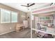 Cozy bedroom with a bunk bed, desk, and plenty of natural light at 472 W Dragon Tree Ave, Queen Creek, AZ 85140