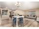Casual dining area with a white table and blue stools at 472 W Dragon Tree Ave, Queen Creek, AZ 85140