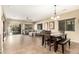 Open dining room with a dark wood table and bench at 472 W Dragon Tree Ave, Queen Creek, AZ 85140
