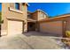 Two-story house with a two-car attached garage and landscaping at 472 W Dragon Tree Ave, Queen Creek, AZ 85140