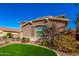 Two-story house with landscaped yard and attached garage at 472 W Dragon Tree Ave, Queen Creek, AZ 85140