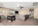Bright Gathering room with plush seating and a large TV at 472 W Dragon Tree Ave, Queen Creek, AZ 85140