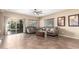 Living room with tile floors, sliding door, and comfy seating at 472 W Dragon Tree Ave, Queen Creek, AZ 85140