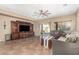 Spacious living room with tile floors, large TV stand, and comfy seating at 472 W Dragon Tree Ave, Queen Creek, AZ 85140