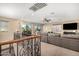 Bright and airy loft area with a comfortable sitting area and access to a balcony at 472 W Dragon Tree Ave, Queen Creek, AZ 85140