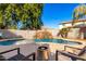 Spacious pool area with fire pit and lounge chairs at 472 W Dragon Tree Ave, Queen Creek, AZ 85140