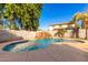 Inviting kidney-shaped pool with a waterfall feature at 472 W Dragon Tree Ave, Queen Creek, AZ 85140