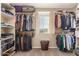Large walk-in closet with ample shelving and hanging space at 472 W Dragon Tree Ave, Queen Creek, AZ 85140