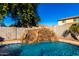 Close-up view of the unique pool waterfall feature at 472 W Dragon Tree Ave, Queen Creek, AZ 85140