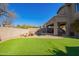 Large backyard with pool, putting green, and covered patio at 4844 E Morning Vista Ln, Cave Creek, AZ 85331