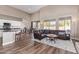 Open concept living room and kitchen with hardwood floors at 4844 E Morning Vista Ln, Cave Creek, AZ 85331