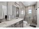 Elegant bathroom with double sinks, glass shower, and gray tile at 5878 E Lone Mountain N Rd, Cave Creek, AZ 85331