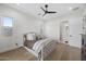 Serene bedroom with light walls, hardwood floors and ceiling fan at 5878 E Lone Mountain N Rd, Cave Creek, AZ 85331