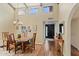 Bright dining room with hardwood floors and a view into the kitchen at 7636 E Medlock Dr, Scottsdale, AZ 85250