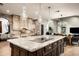 Gourmet kitchen featuring granite countertops and custom cabinetry at 8330 E Captain Dreyfus Ave, Scottsdale, AZ 85260