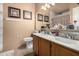 Clean bathroom with double sinks and shower/tub combo at 8717 W Wilshire Dr, Phoenix, AZ 85037