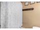 Simple bathroom with shower stall and decorative accents at 8717 W Wilshire Dr, Phoenix, AZ 85037
