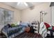Charming bedroom with a double bed and window at 8717 W Wilshire Dr, Phoenix, AZ 85037