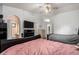 Bright bedroom with two beds and a view of the bathroom at 8717 W Wilshire Dr, Phoenix, AZ 85037