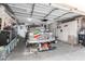 Garage with classic car, shelving and storage at 8717 W Wilshire Dr, Phoenix, AZ 85037