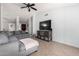 Bright living room with grey sectional and backyard access at 8717 W Wilshire Dr, Phoenix, AZ 85037