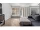 Living room with sectional sofa and large window at 8717 W Wilshire Dr, Phoenix, AZ 85037