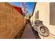 Side yard with walkway and tire storage at 8717 W Wilshire Dr, Phoenix, AZ 85037